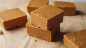 3 Ingredient Peanut Butter Fudge stakes on a serving area