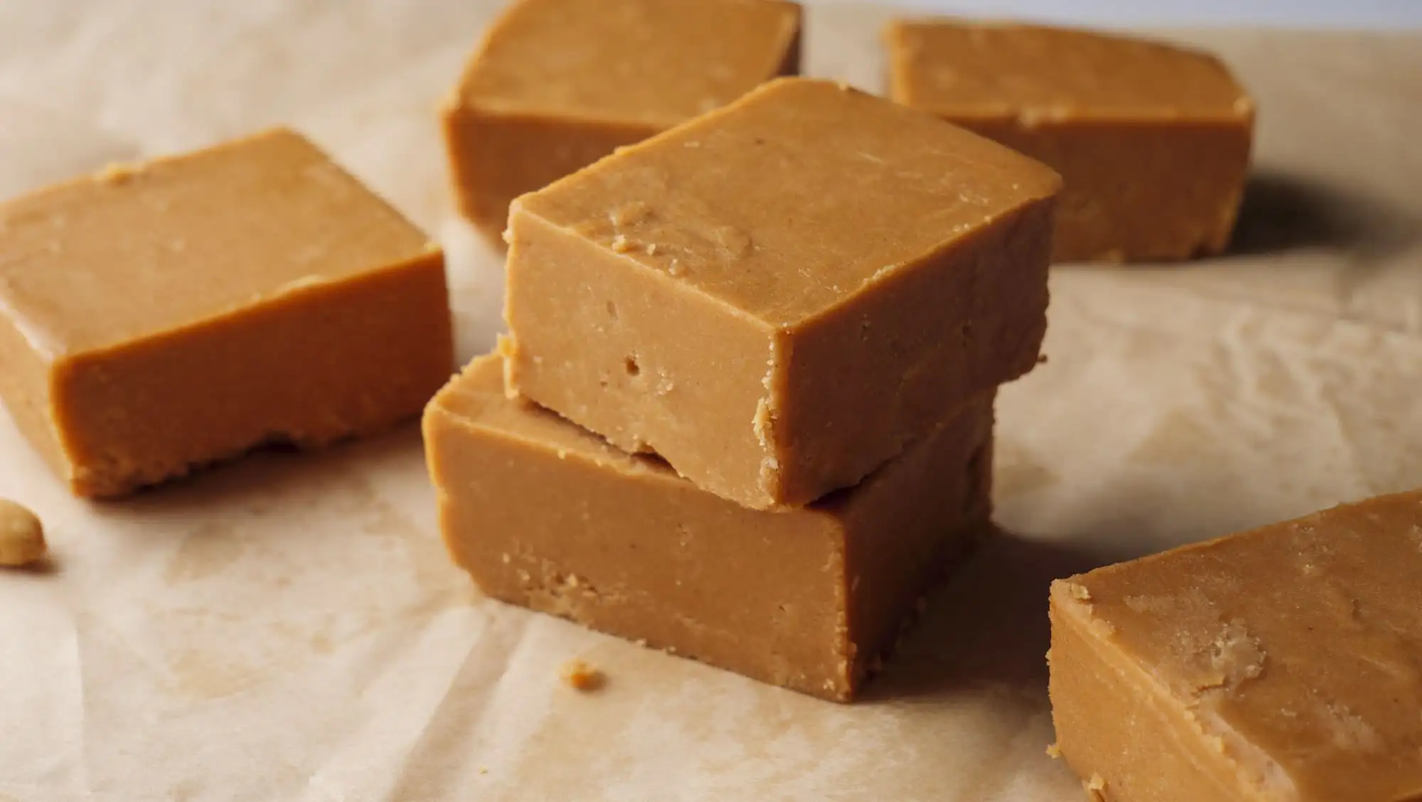 3 Ingredient Peanut Butter Fudge stakes on a serving area
