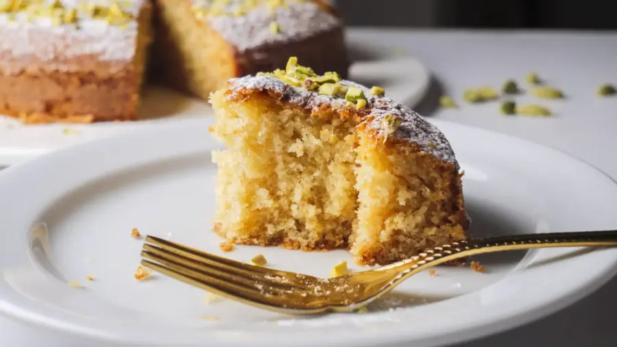 Swedish Cardamom Cake on a serving plate with a fork