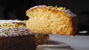 Cardamom Cake sliced with a knife