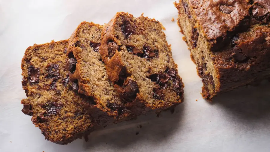 Chocolate Chunk Banana Bread slices on a servinfg board