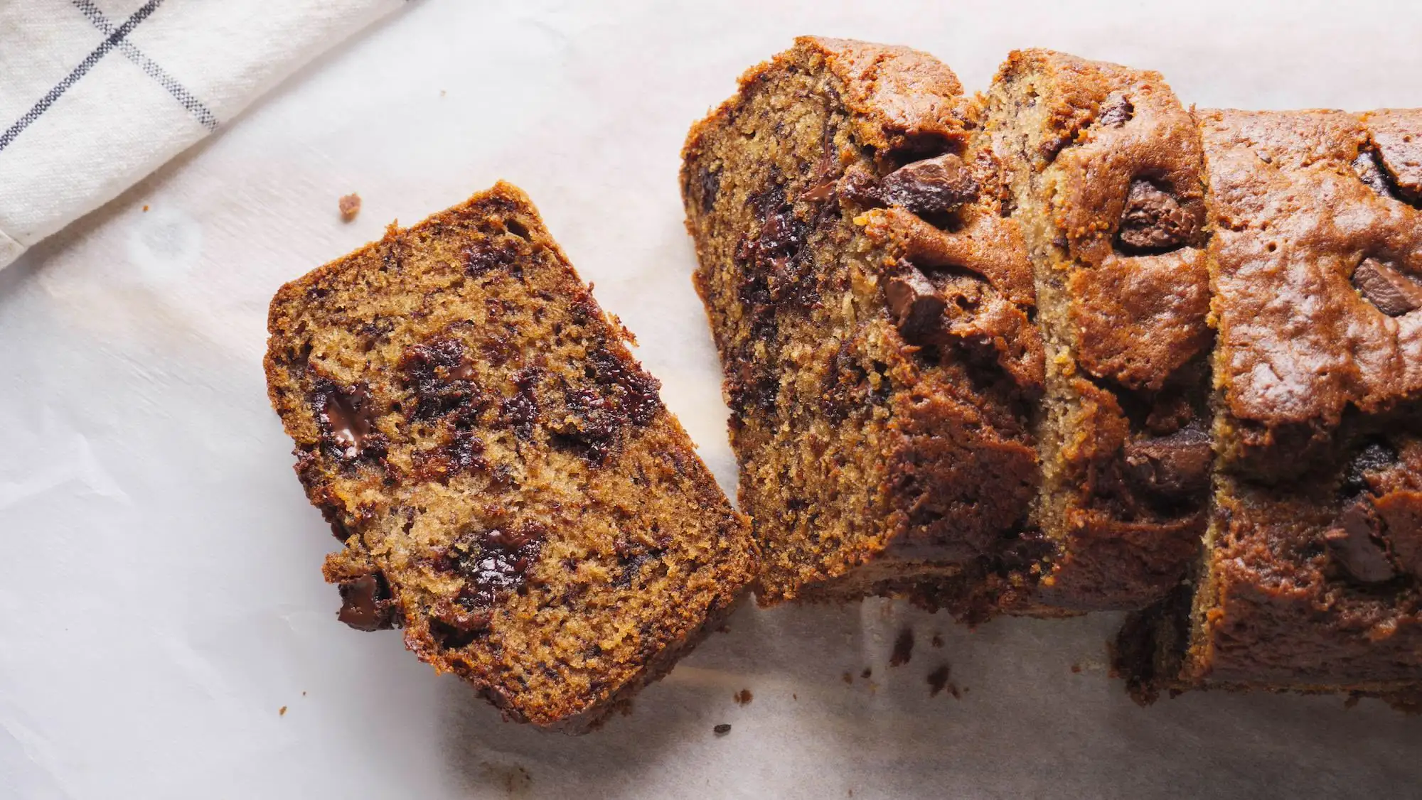 Chocolate Chunk Banana Bread slices on a servinfg board