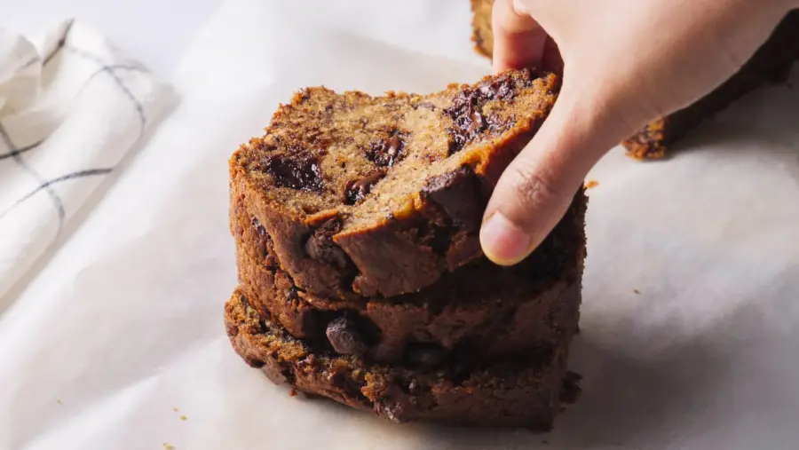 Chocolate Chunk Banana Bread slices stake on a serving area