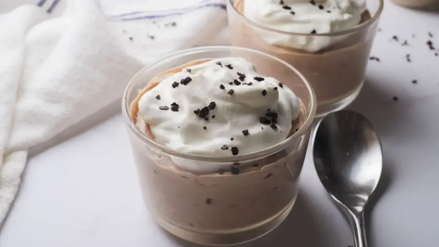 Nutella Mousse served in glasseware with a spoon