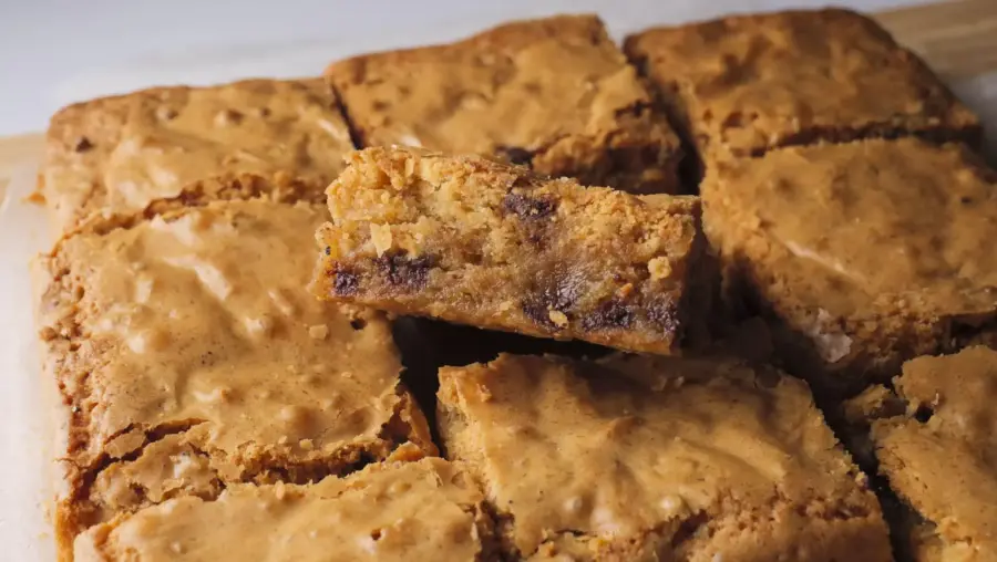 Brown Butter Blondies are placed on a serving board
