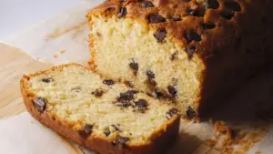 Chocolate Chip Loaf Cake placed on a serving board