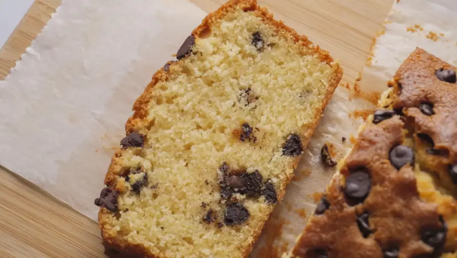 Chocolate Chip Loaf Cake placed on a serving board