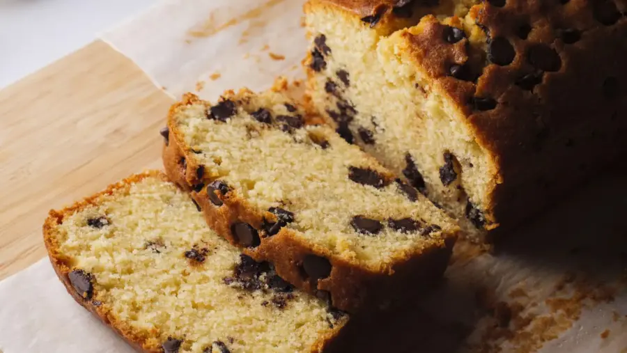 Chocolate Chip Loaf Cake placed on a serving board