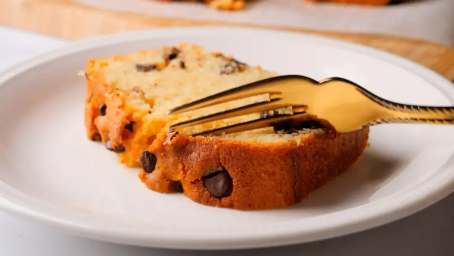 Chocolate Chip Loaf Cake served on a serving plate along with a fork