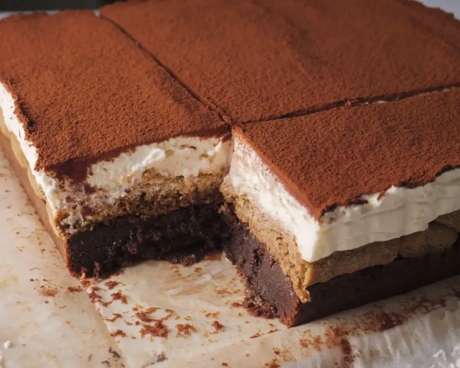 Tiramisu Brownies on a cutting board with parchment paper