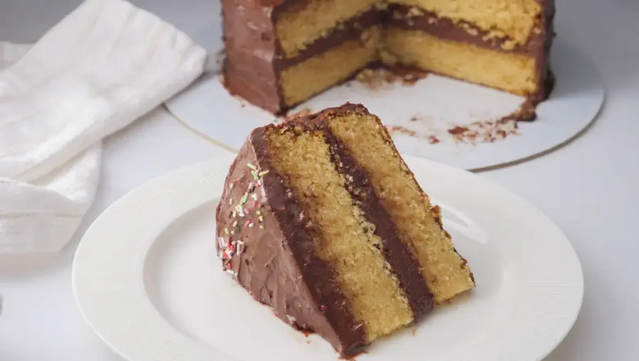 Vanilla Cake with Chocolate Frosting served on a serving plate
