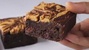 peanut butter banana brownies one piece holding in hand