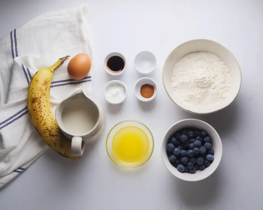 Banana Blueberry Pancakes Ingredients on a kitchen counter