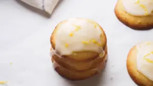 Lemon Glaze on lemon cookies with some lemon zest