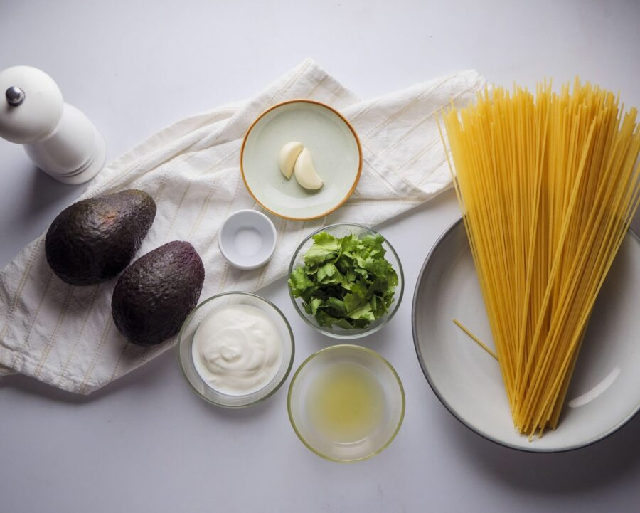 Avocado Pasta Recipe Ingredients On a white kitchen counter top