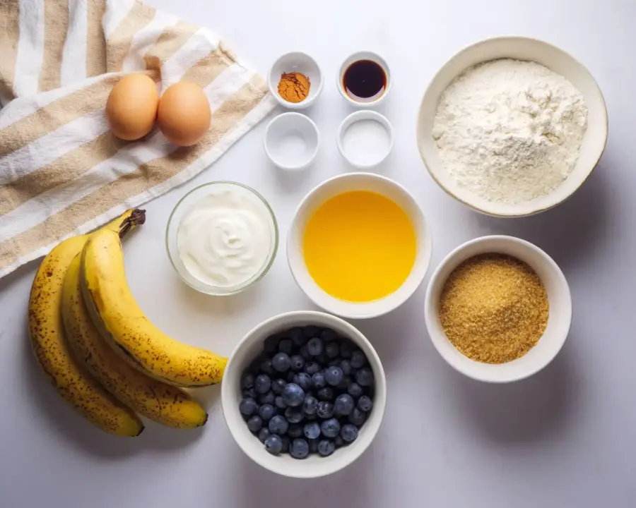 Blueberry Banana Bread Recipe Ingredients on a white kitchen counter top