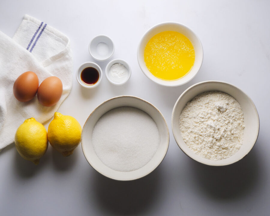 Lemon Brownies Baking ingredients: eggs, lemons, flour, sugar, butter, vanilla.