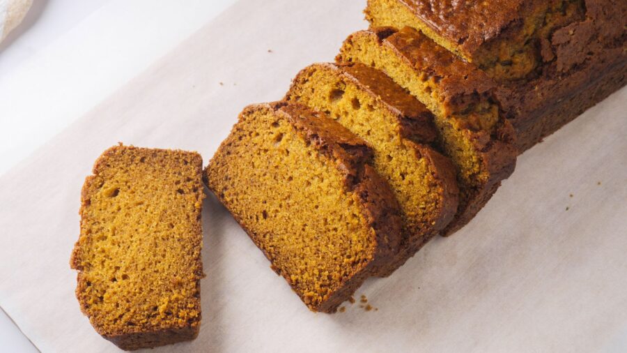 Sliced pumpkin bread served on parchment paper