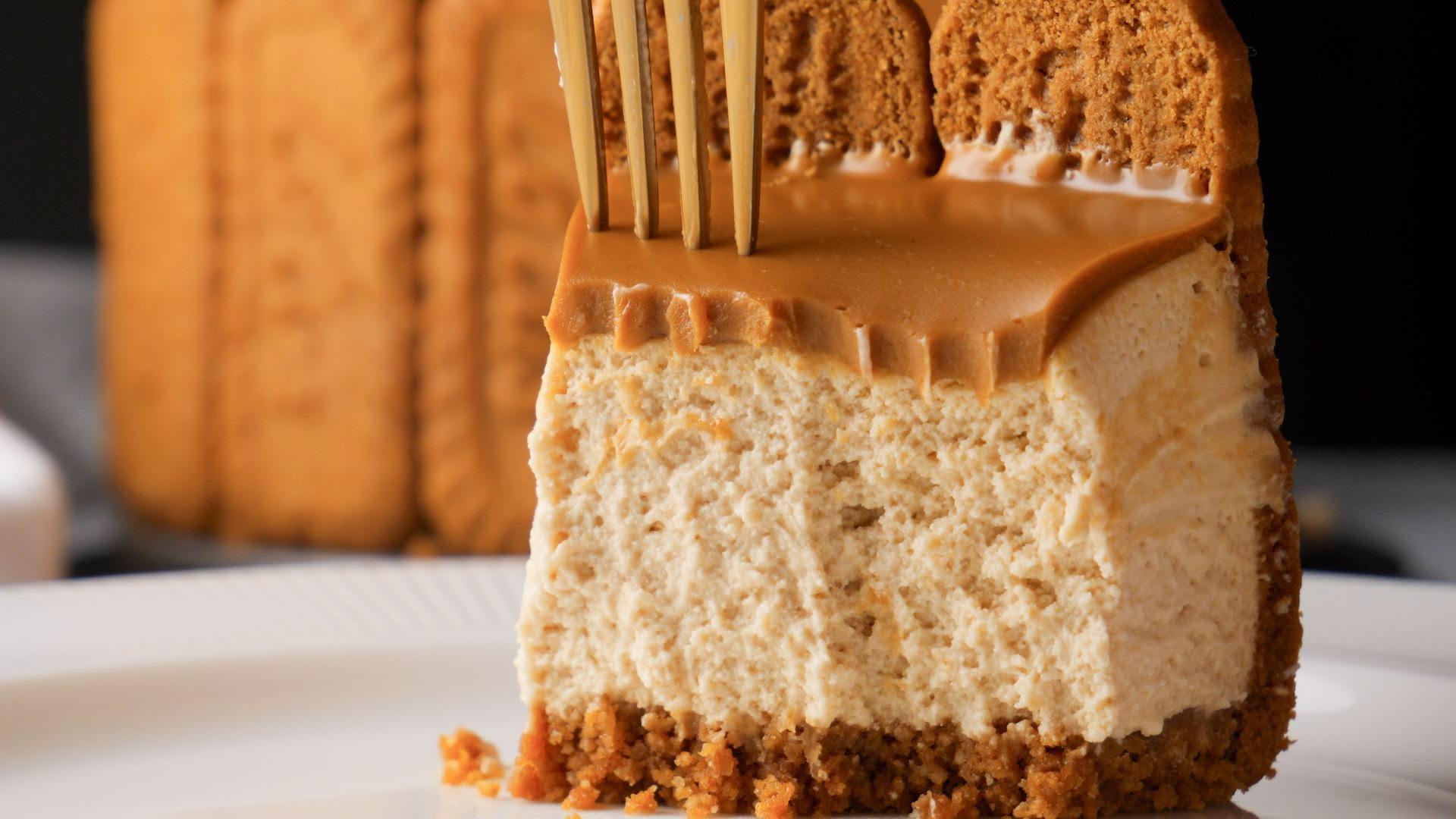 Creamy No Bake Biscoff cheesecake slice with biscuit crust on plate.