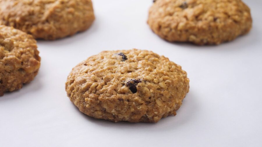 Best chewy Oatmeal raisin cookies placed on a white background.