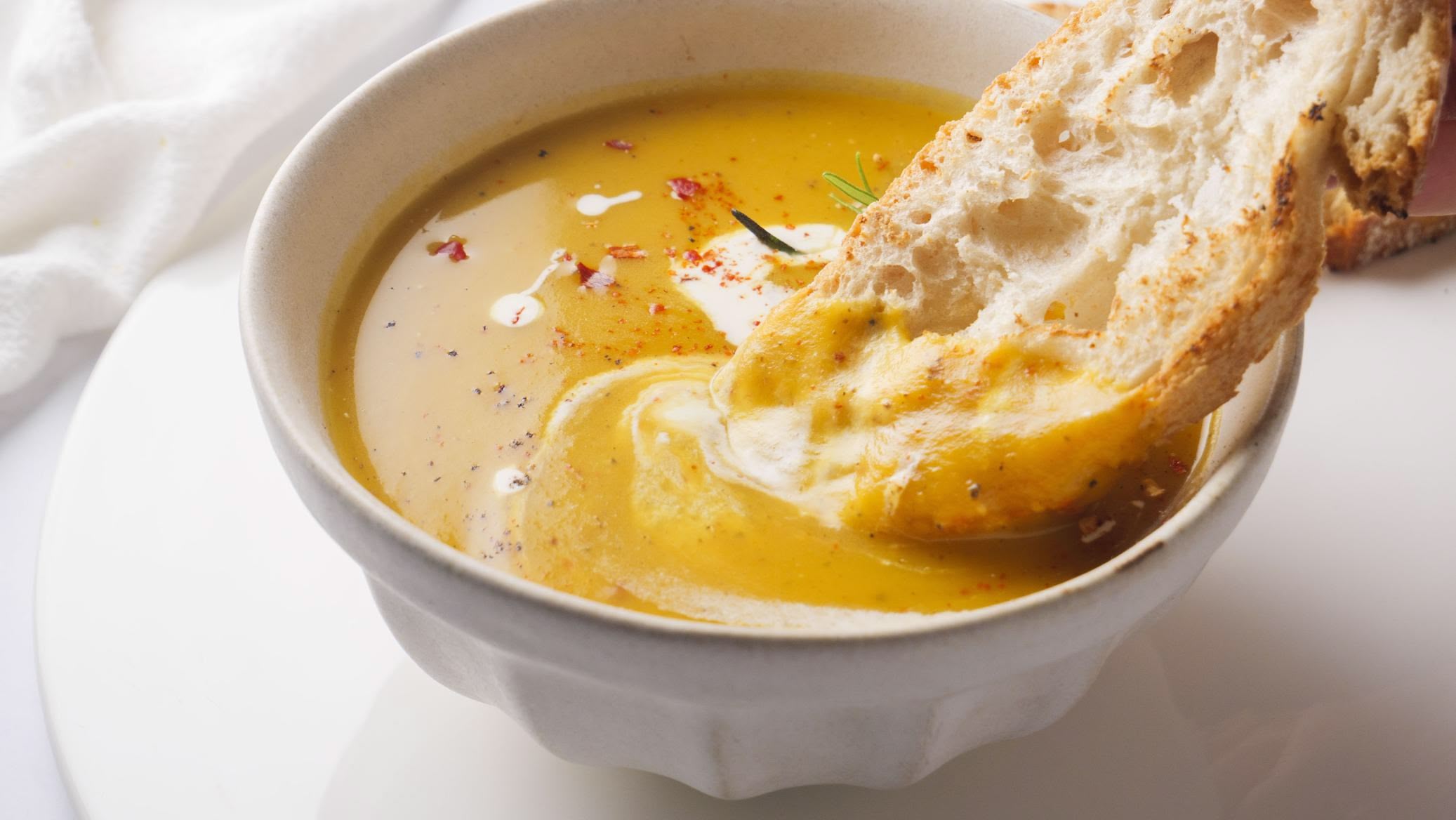 Creamy butternut squash soup with crusty bread.