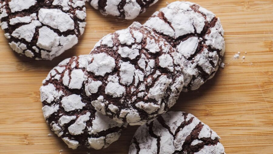 Best Chewy Chocolate Crinkle Cookies on a wooden board.