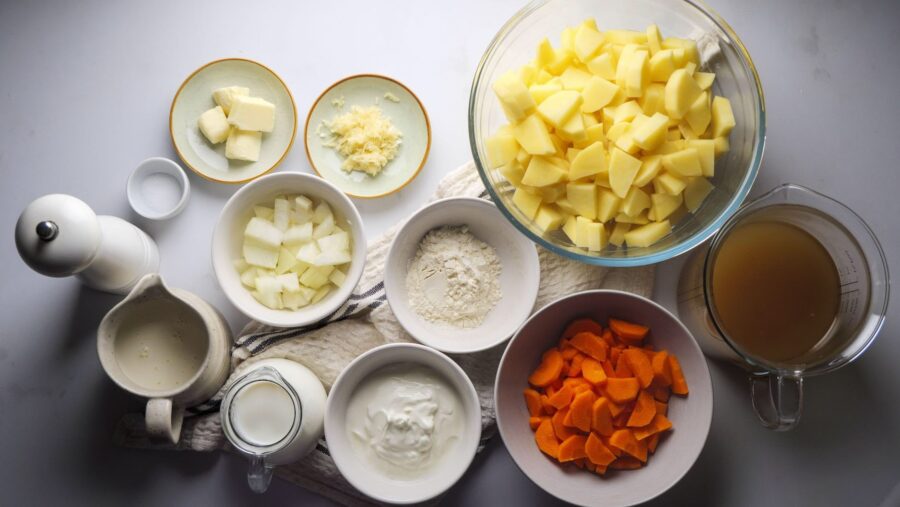 Chopped veggies and ingredients for a hearty Potato soup recipe.
