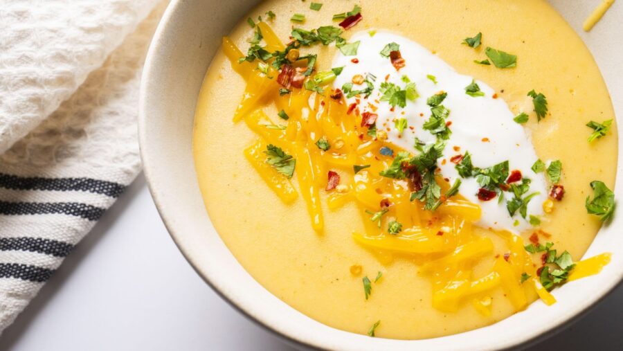Creamy Potato soup with cheese, herbs, and sour cream topping.