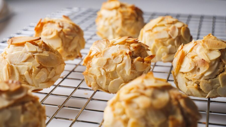 Italian Almond cookies are cooling on a wire rack.