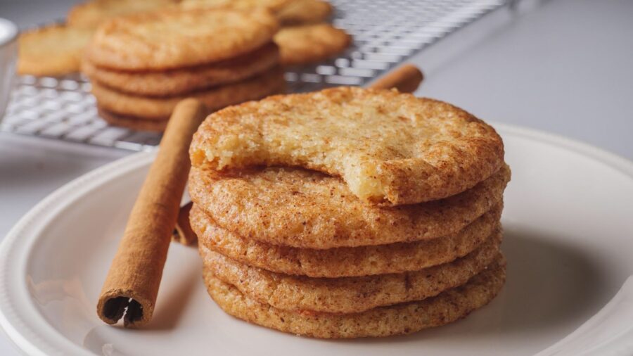 Stack of snickerdoodle cookies with a bite taken out
