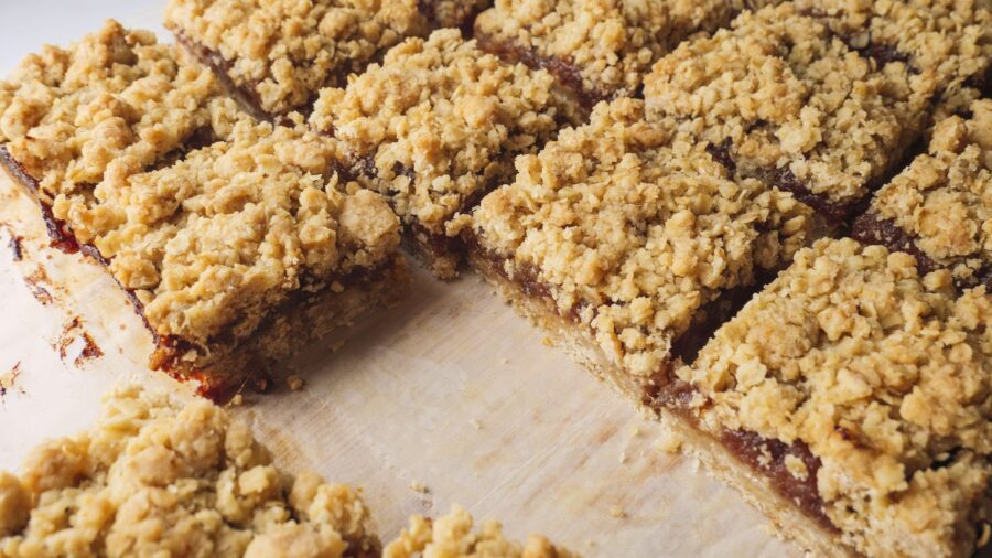 Crisp oat crumble bars on parchment paper.