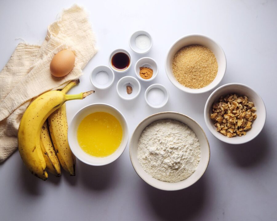 Ingredients for Banana Muffins Recipe placed on a white kitchen counter