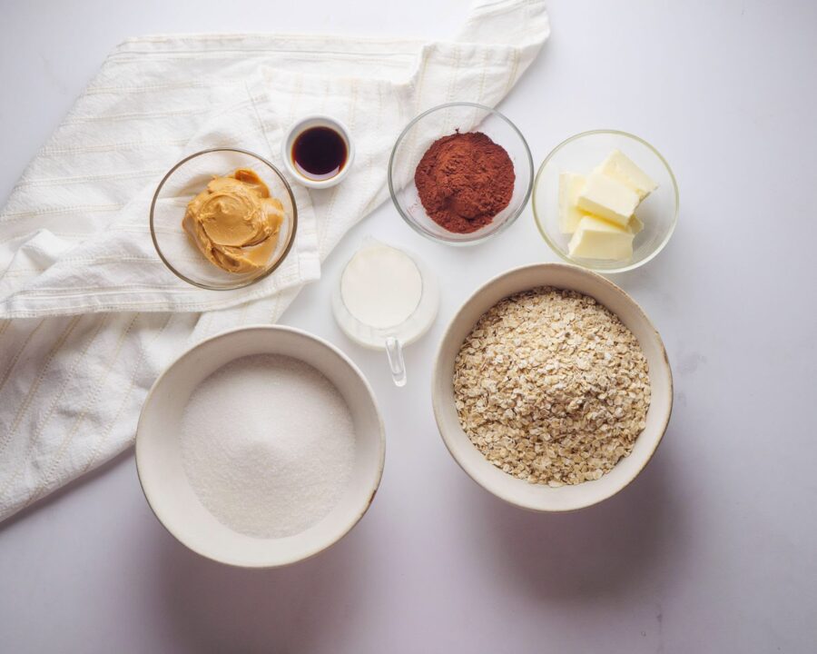 Baking ingredients: oats, cocoa, peanut butter, butter, sugar, vanilla.