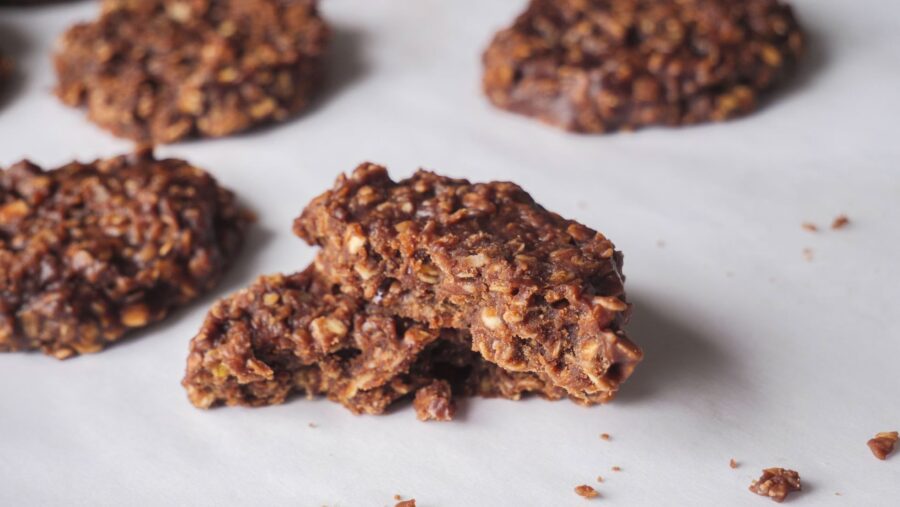 chocolate peanut butter cookies on white parchment paper.