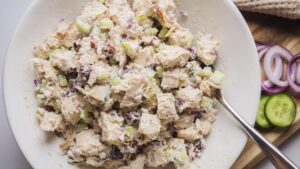 Creamy chicken salad with cucumber and raisins, almonds