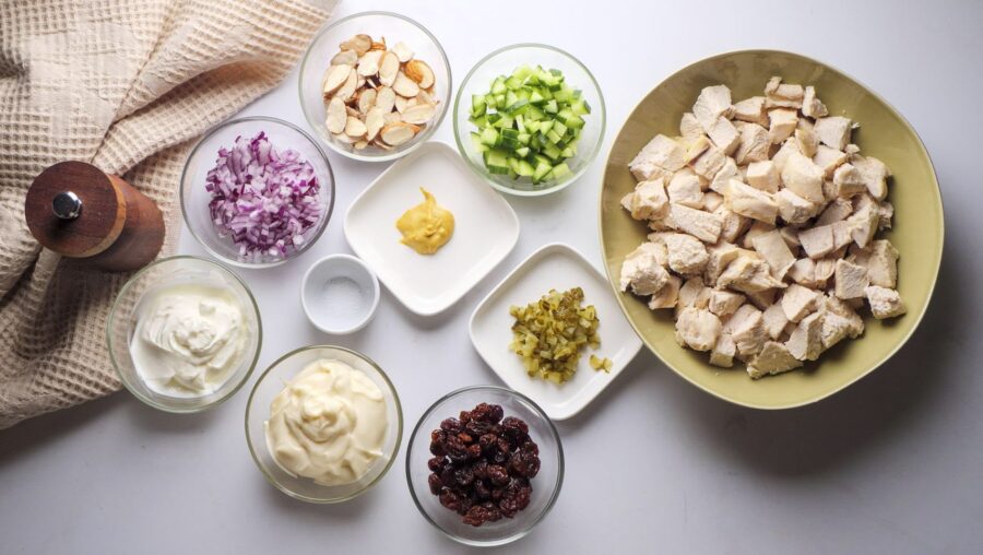 Creamy Chicken Salad Recipe Ingredients on a white kitchen counter