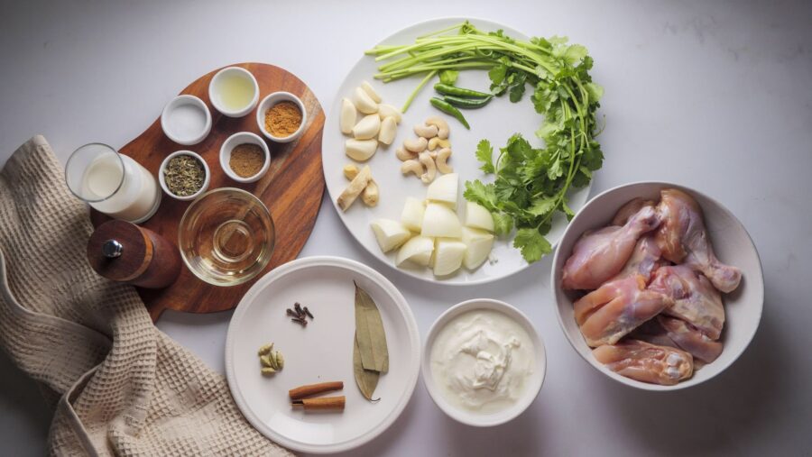 Afghani Chicken Curry ingredients on a kitchen counter table.