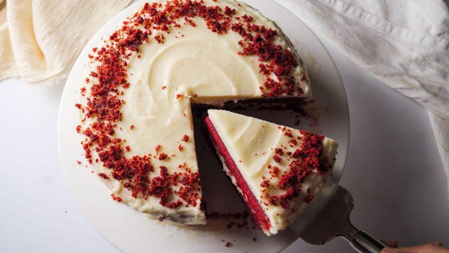 bakery-style red velvet cake at home, placed on a cake stand