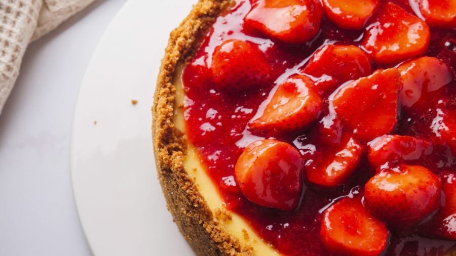 Strawberry-topped cheesecake with graham crust.
