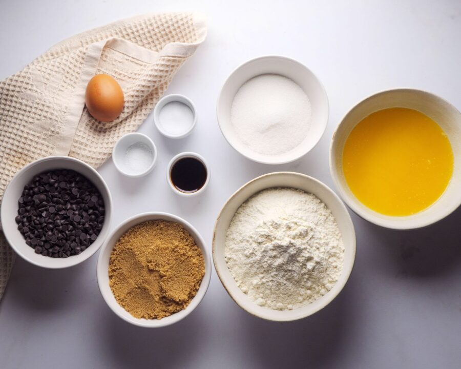 Ingredients For Chocolate Chip Skillet Cookie Recipe place on a white kitchen counter