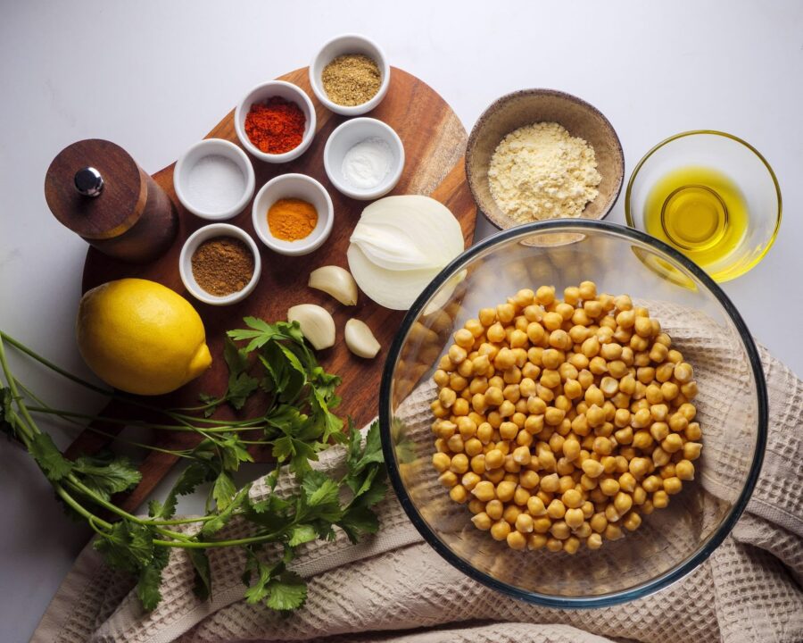 Chickpea recipe ingredients on wooden board.