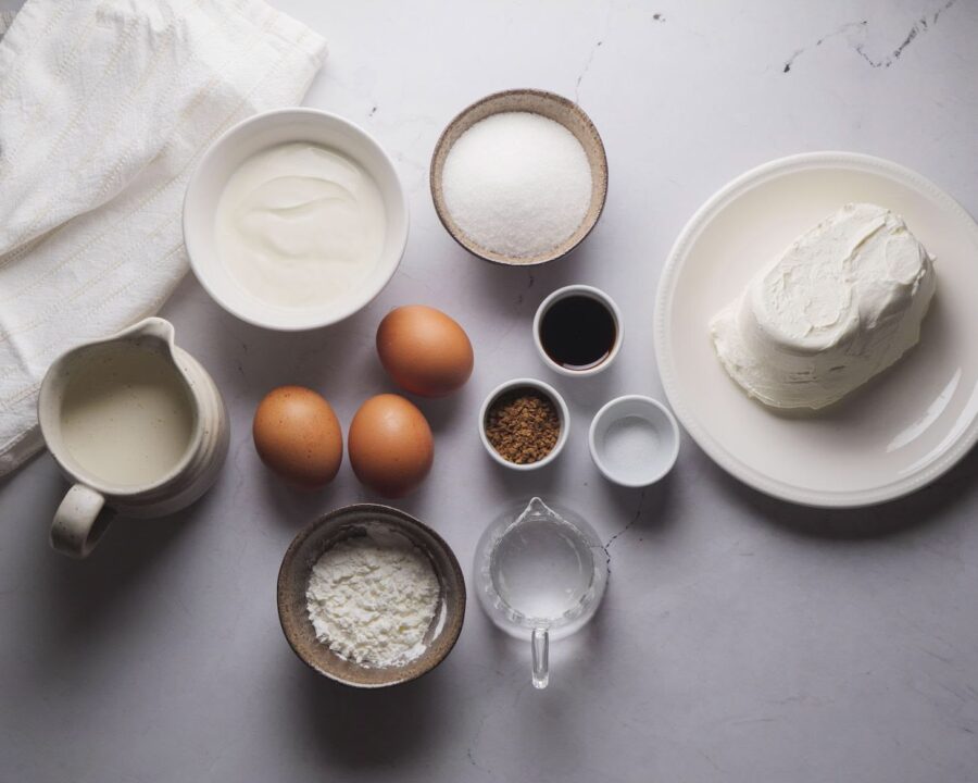 Coffee Cheesecake Recipe Ingredients on a white kitchen counter