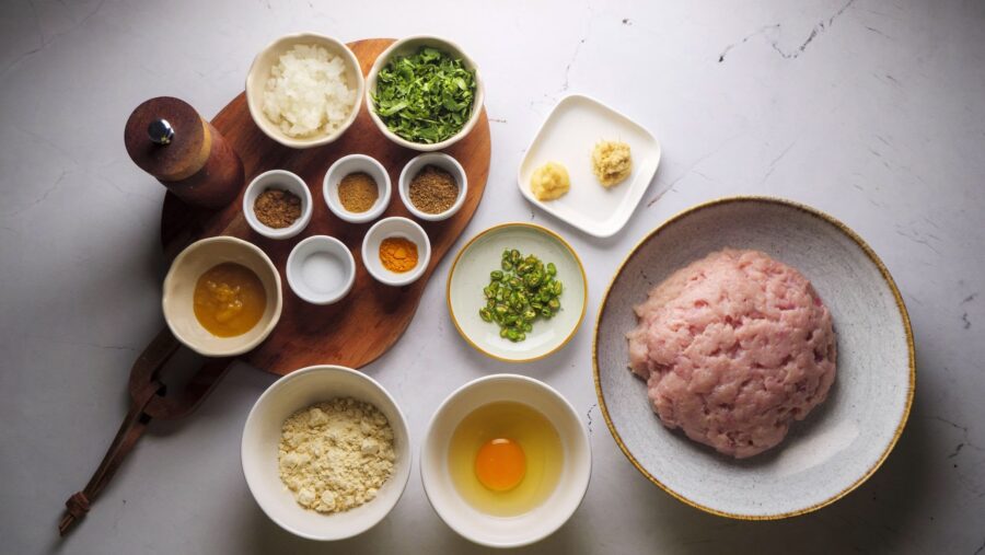 chicken meatball curry ingredients for making the meatball on the white kitchen counter