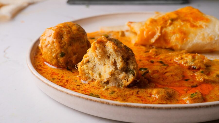 Chicken Meatball Curry served in a bowl with paratha